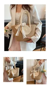 Detailed close-up of woven straw tote bag featuring a large lace bow and textured handles