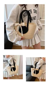 Detailed close-up of beige woven tote bag with lace bow and black rope handles