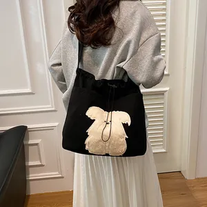 Large black corduroy tote bag with plush puppy patch and drawstring closure for women