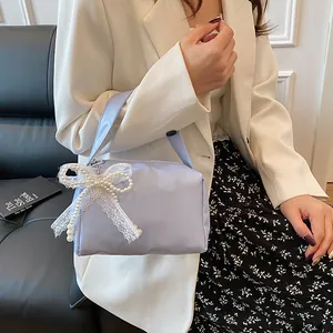 Chic lavender handbag with lace bow and faux pearls decoration for elegant style