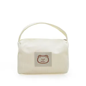 Minimalist beige corduroy handbag with cute bear patch and zipper closure