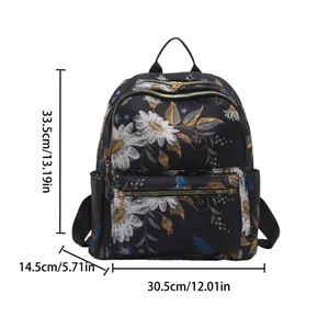 Chic floral printed backpack for women with bird motifs and golden zippers in black nylon