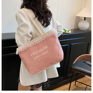 Pink denim tote bag with white lace trim and letter print for casual shoulder carry