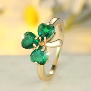 Chic gold-plated lucky clover ring featuring three heart-shaped emerald green gemstones