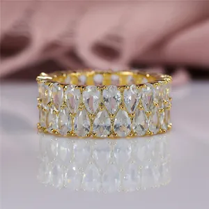 Elegant gold-tone ring featuring double rows of pear-cut sparkling zircon stones