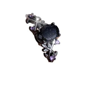 Gothic black vine ring featuring an oval blue sandstone and purple gem accents