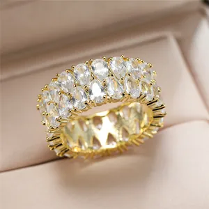 Macro view of golden eternity ring with double rows of sparkling pear-cut crystals