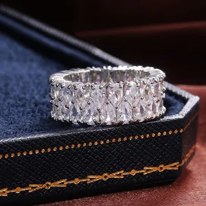 Double row marquise-cut zircon eternity ring in silver finish on a blue velvet box