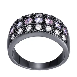 Elegant black plated ring with pavé-set purple and white zircons on a white background