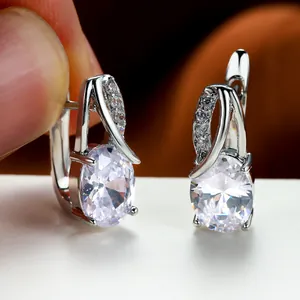 Oval light blue zircon hoop earrings in champagne gold finish for engagement and weddings