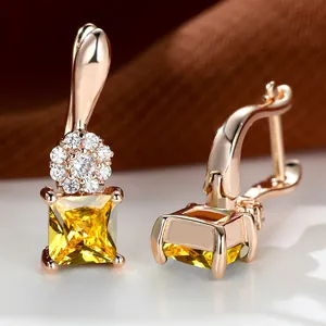 Rose gold sunflower earrings with blue sapphire square zircon and champagne gold accents