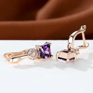 Champagne gold sunflower hoop earrings with square purple crystals and white zircon