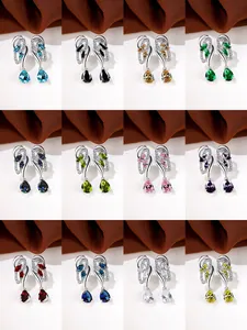 Detail view of 12 colors of drop earrings with pear-cut gemstones and silver metal finish