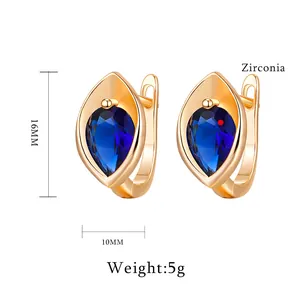 Créoles minimalistes en or champagne avec zircons bleu profond en forme de poire