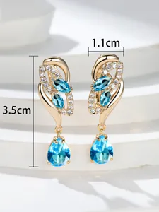 Detailed view of champagne gold drop earrings with dimensions 3.5cm by 1.1cm