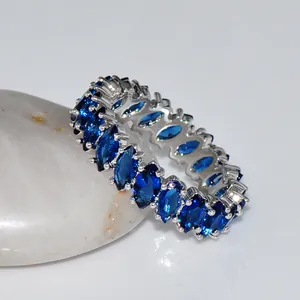 Eternity ring with marquise-cut blue cubic zirconia stones in silver-plated setting