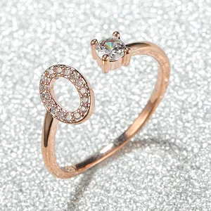 Rose gold adjustable ring featuring a large round gemstone and small pavé crystal circle