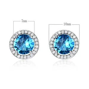 Boucles d'oreilles en argent avec zircon bleu de 7mm et un halo de cristaux blancs