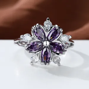 Detailed macro shot of a purple zircon flower ring with silver metal petal settings