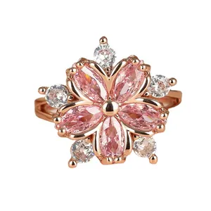 Elegant cherry blossom ring featuring pink marquise-cut stones in rose gold plating
