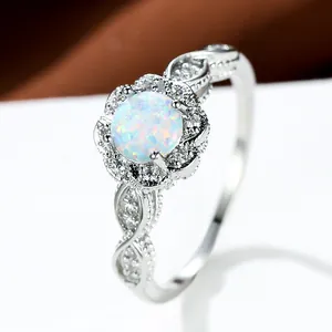Vintage white opal flower ring with sparkling zircon halo and lace hollow band