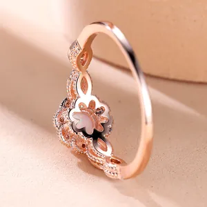 Rose gold flower ring with round opal gemstone and vintage beaded lace edge detail