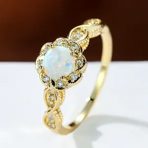 Vintage gold opal flower ring with white round stone and intricate twisted lace band