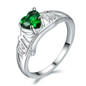 Elegant silver MOM ring featuring a heart-shaped green stone and shimmering side diamonds