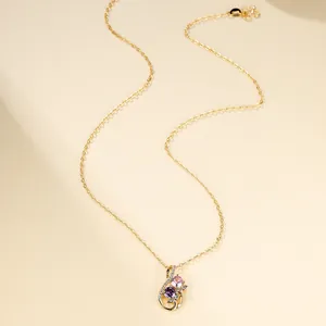 Goldene Tulpenkette mit rosa und violetten Edelsteinen und einer filigranen Gliederkette