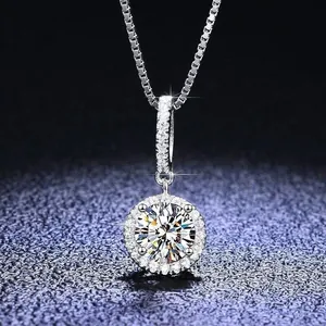 Elegant silver halo pendant necklace with a round brilliant-cut center stone and pave diamonds