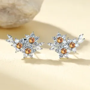 Exquisite flower cluster stud earrings with amber center stone and white zircon accents