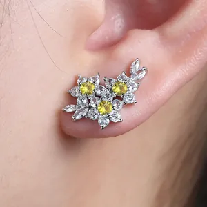 Elegant silver flower stud earrings with blue zircon and pear-shaped accents for women