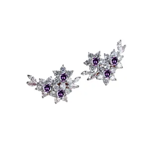 Floral cluster stud earrings with purple center stones and marquise-cut accents