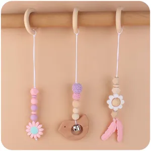 Set tre pezzi di giochi per palestrina neonato con fiore in silicone e uccellino