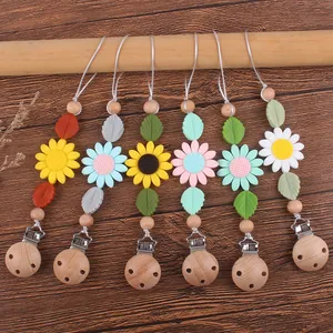 Attache-tétine en bois de hêtre et silicone tournesol pour bébés en plusieurs couleurs