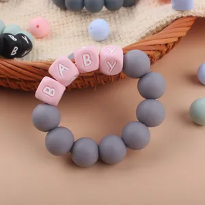 DIY baby silicone teether bracelet with pink BABY letter beads and grey sensory pearls