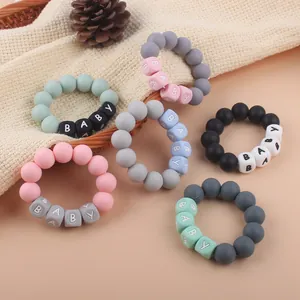 Set of 6 colorful silicone baby teething bracelets with BABY letter beads for motor skills