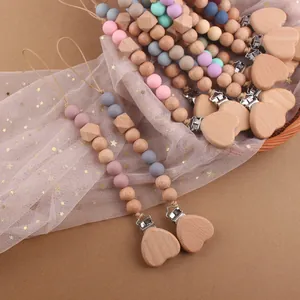 Handmade beech wood and silicone baby pacifier clip with heart clamp on soft pink tulle