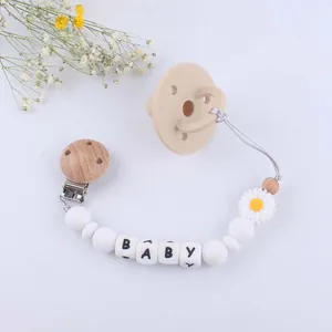 Daisy silicone baby pacifier and pacifier clip with white beads and wooden clamp