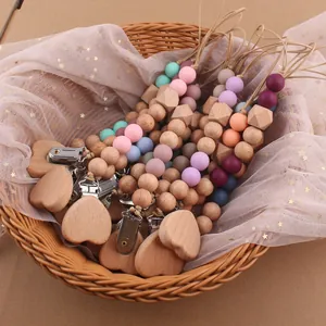 Silicone and beech wood baby pacifier clip with heart shaped wooden clamp and pastel beads