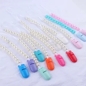 Colorful baby pacifier clips with faux pearl beads in multiple bright color variations