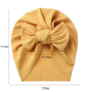 Ginger yellow baby turban hat with oversized bow showing dimensions 17.5cm by 17cm