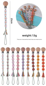 Détail d'attache-tétine marguerite au crochet de 25 cm avec clip en hêtre et coton tressé