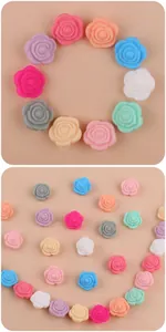 Macro view of colorful silicone rose flower beads for DIY pacifier clips and teething jewelry