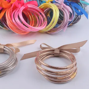Set di braccialetti in silicone glitterato con fiocco decorativo in vari colori