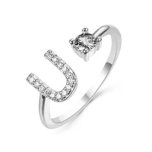 Adjustable silver letter U ring with sparkling pavé stones and round zircon solitaire