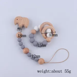 Set de sujetachupetes de madera de haya elefante y mordedor con medidas detalladas