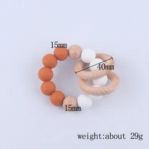 Baby teething bracelet with orange silicone beads and natural beech wood rings