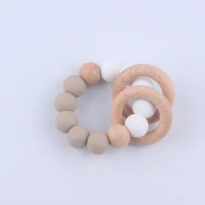 Detail of baby teether bracelet with silicone beads and natural beech wood rings