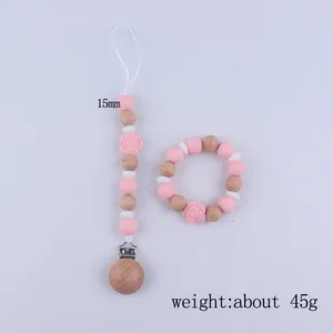Pink cartoon silicone rose teether with pacifier clip and wooden bead bracelet set